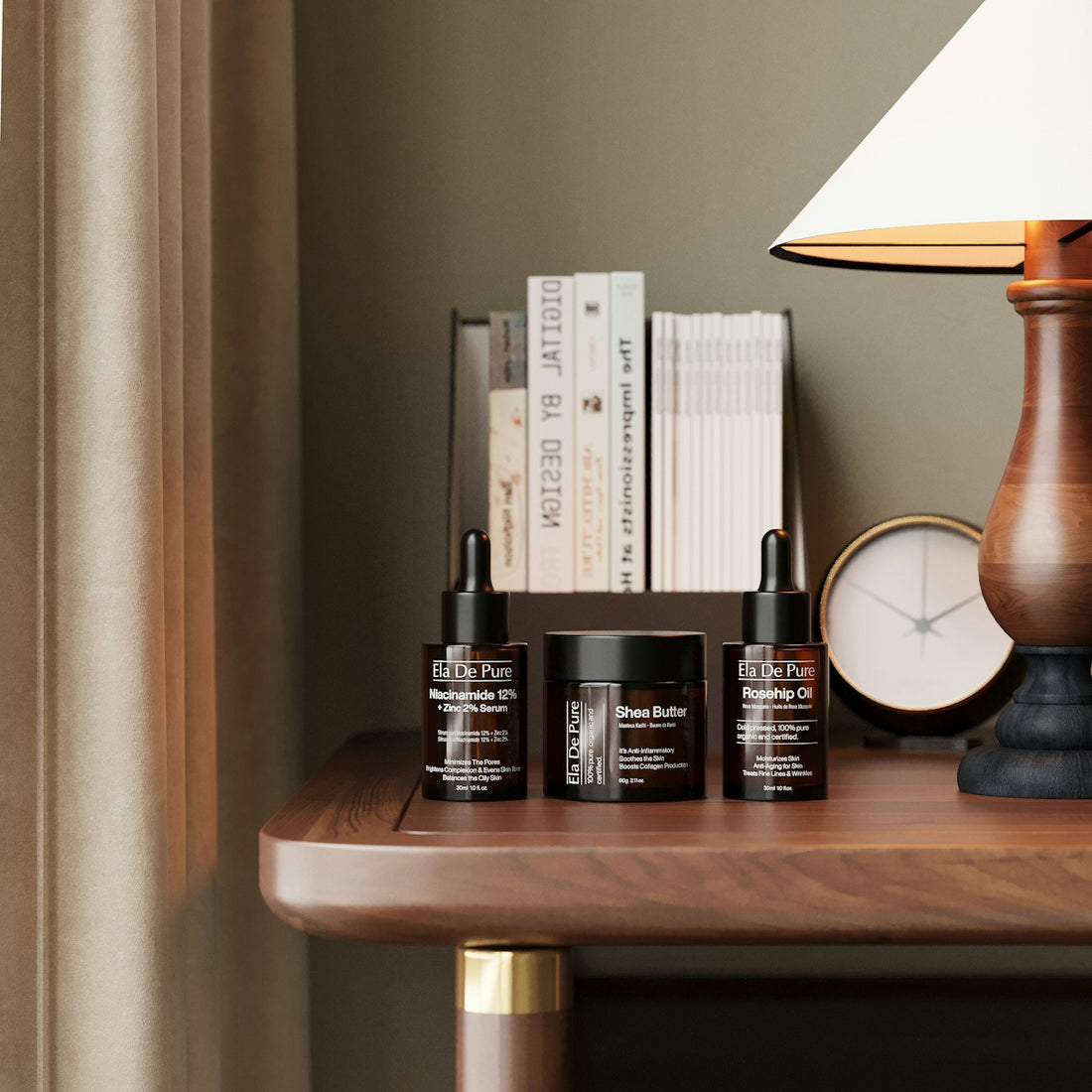 Skincare products, books, and a lamp on a wooden table.